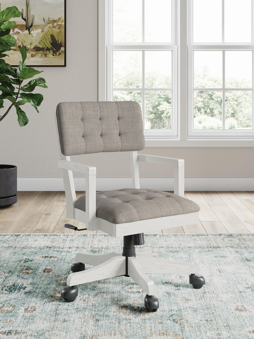Tufted fabric desk chair with light wood frame, swivel base, and rolling casters