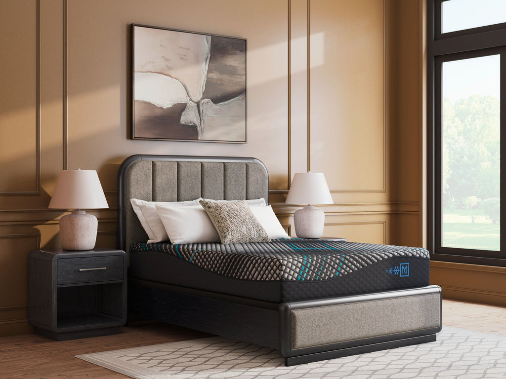 Black hybrid mattress on bed frame with white grid top and teal accents