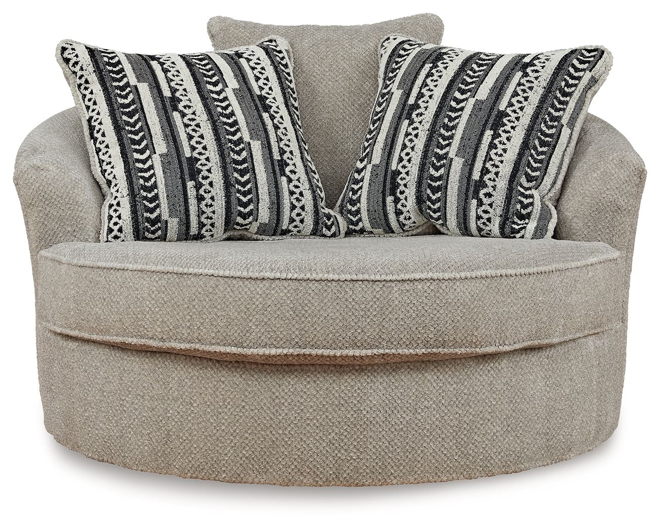Light beige oversized accent chair with striped geometric throw pillows and round swivel seat