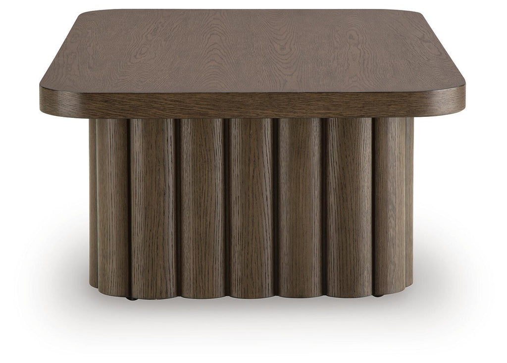 Dark brown oval side table with wood grain top and ribbed pedestal base
