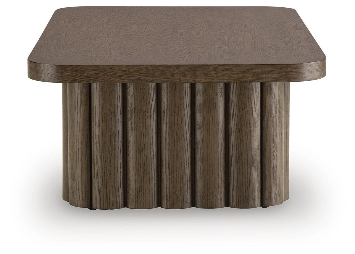 Dark brown oval side table with wood grain top and ribbed pedestal base