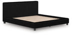 Black upholstered platform bed with tall headboard and beige mattress insert.