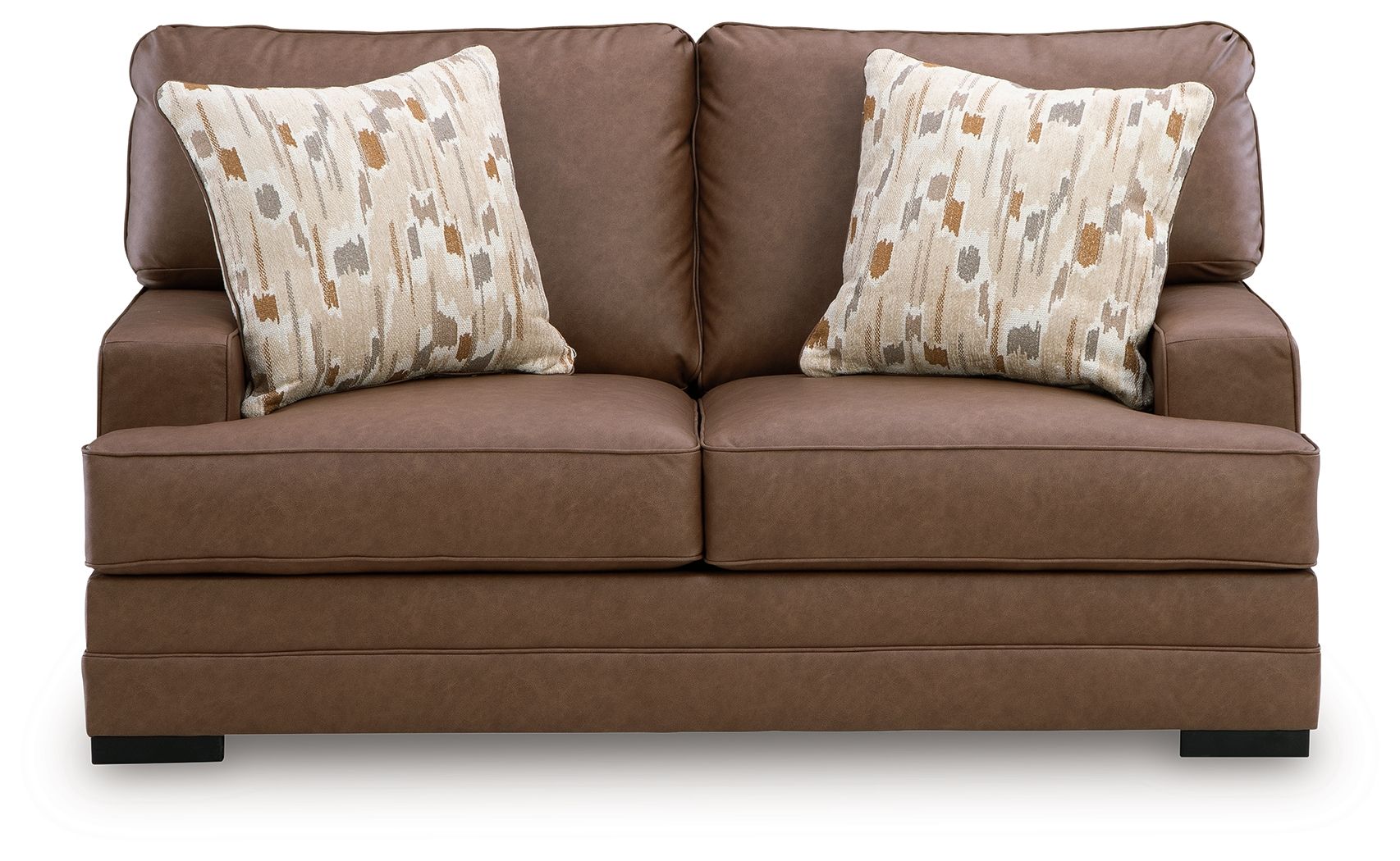Caramel-brown loveseat with two patterned throw pillows and low profile
