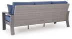 Blue outdoor sofa with gray frame and woven back panel, no front cushions shown
