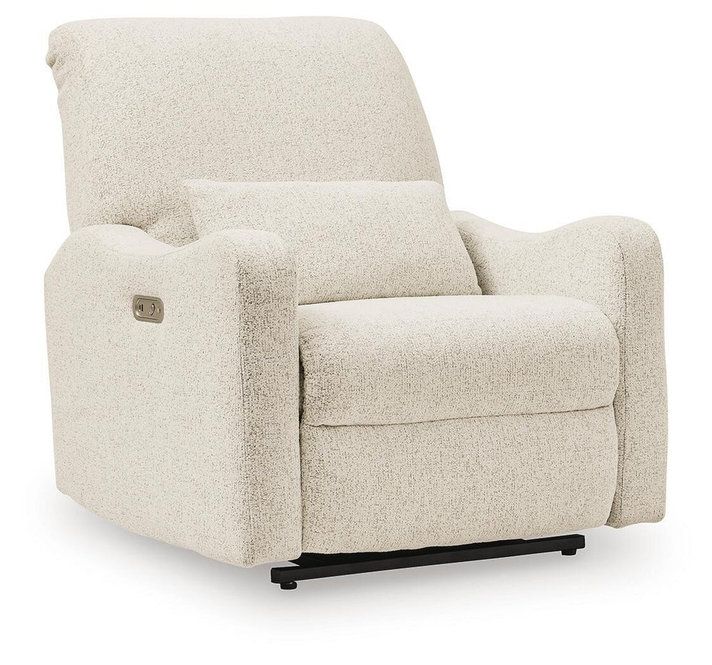 Power recliner chair with plush light beige upholstery and wide padded arms