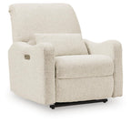 Power recliner chair with plush light beige upholstery and wide padded arms