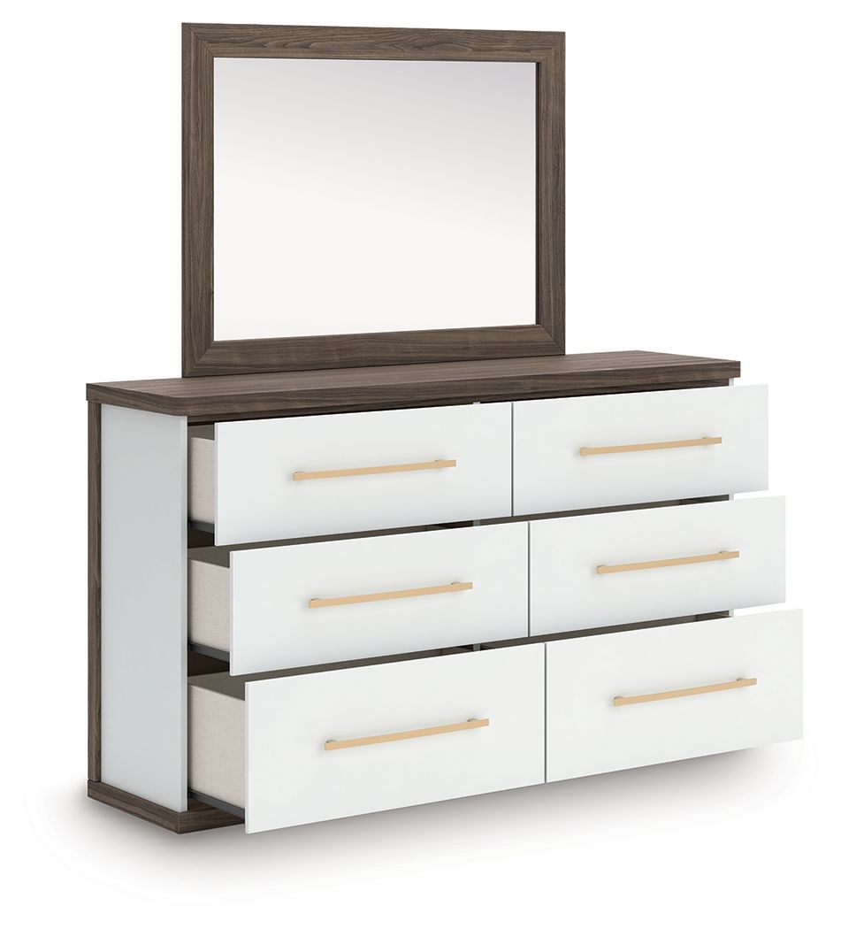 Six-drawer dresser with open drawers and mirror, white drawers, warm wood frame, gold pulls.