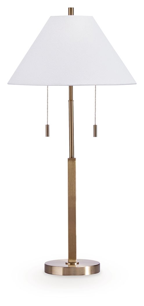 Gold metal lamp with white drum shade, tall stem, and round weighted base.