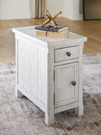 White side table with paneled cabinet doors and a drawer, distressed wood finish.