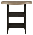 Round outdoor dining table with driftwood top and black legged base
