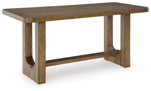 Rectangular dining room table in light brown wood with straight legs and apron