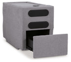 Gray upholstered console with two black openings and open front storage compartment