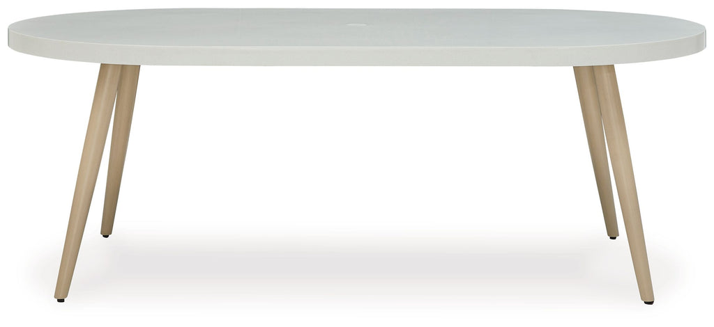 White oval dining table with tapered legs and side profile