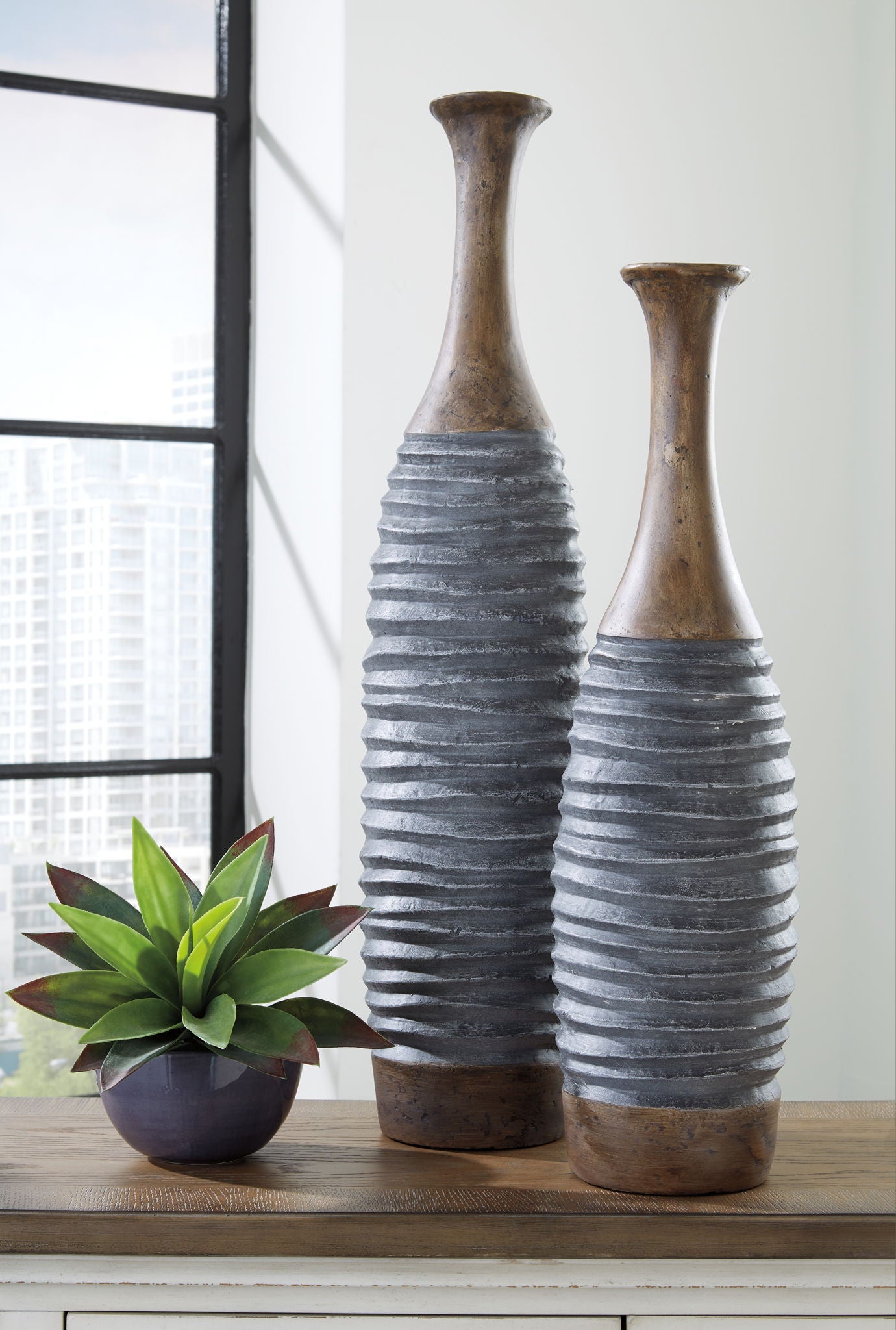 Two tall ribbed vases with antique gray-blue bands and brown distressed necks