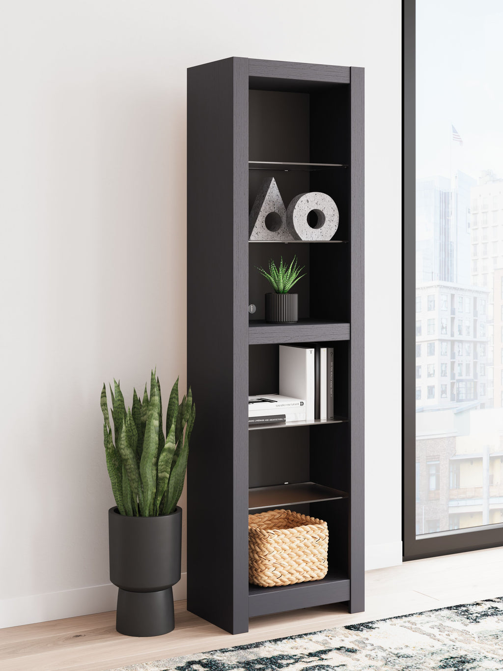 Black tall open bookshelf with several shelves holding decor and baskets