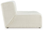 Ivory accent chair with textured fabric, curved back panel, and padded armrests