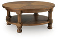 Chadworth - Round Cocktail Table - Medium Brown