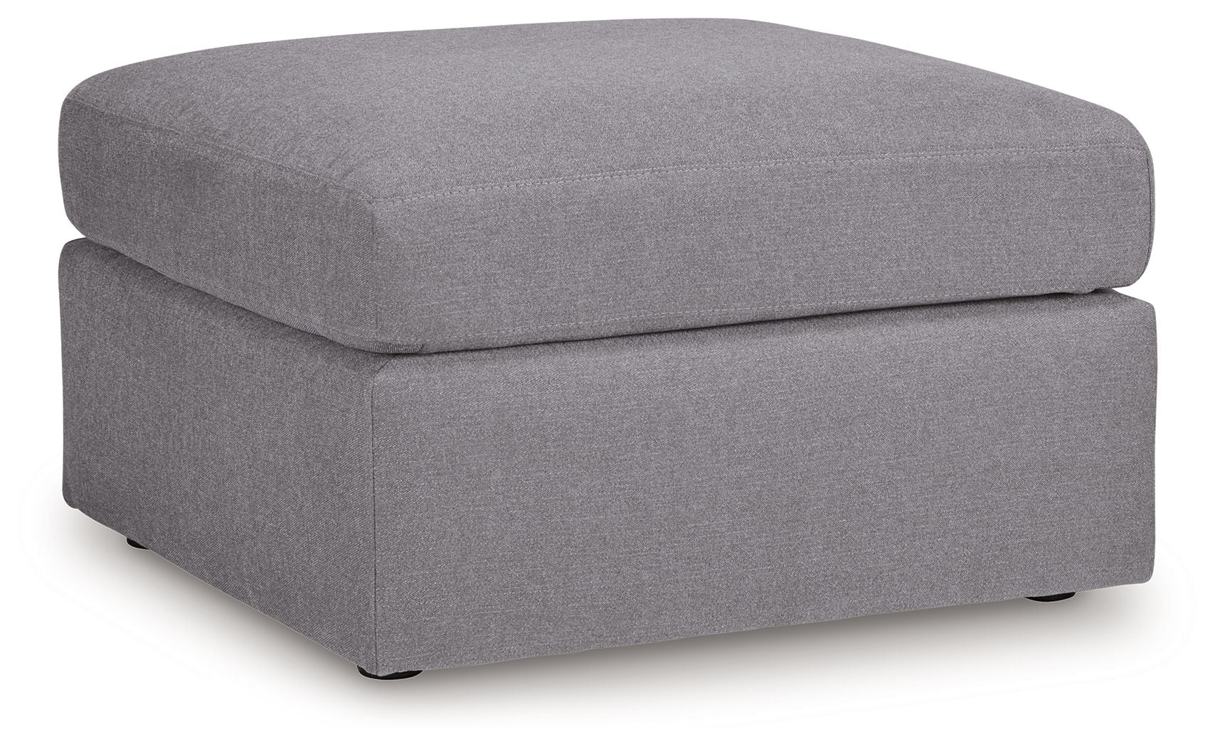 Gray accent ottoman with cushioned top and square two-tier base.