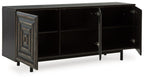 Distressed black accent cabinet with open door showing interior shelves and hinges.