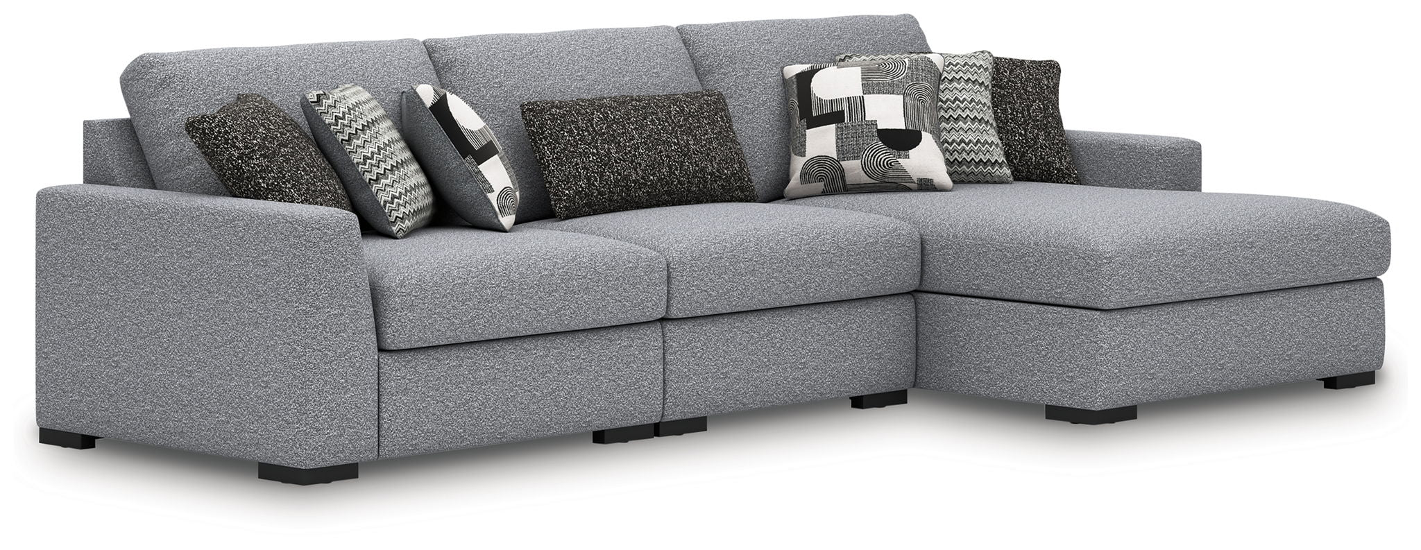 Gray fabric sectional sofa with chaise corner and patterned accent pillows