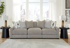 Light gray 3-seat sofa sectional with textured pillows and geometric accent cushions