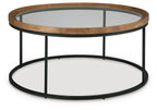 Round side table with clear glass top, light brown wood rim, black metal legs, lower shelf