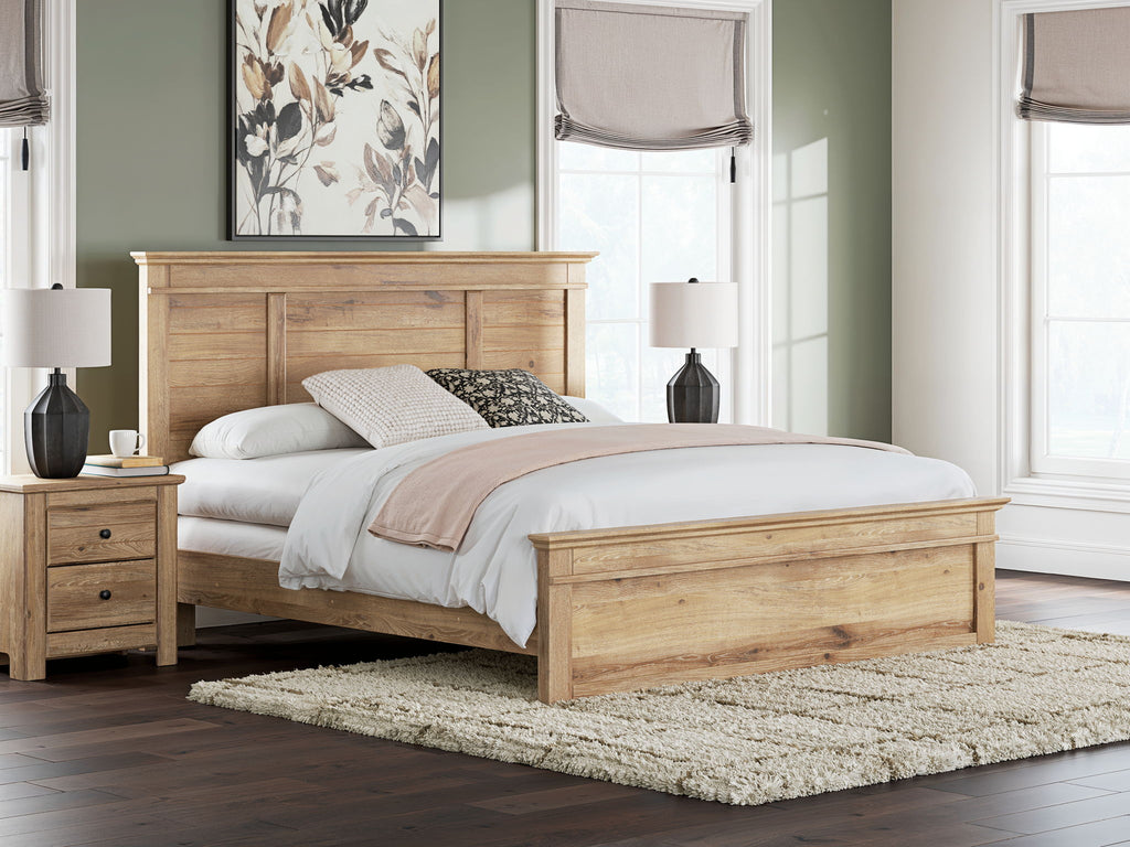 Light brown panel bed with tall headboard, white bedding, and mixed neutral pillows.
