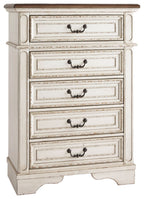 Chipped white chest of drawers with five cabinet drawers and curved metal pulls
