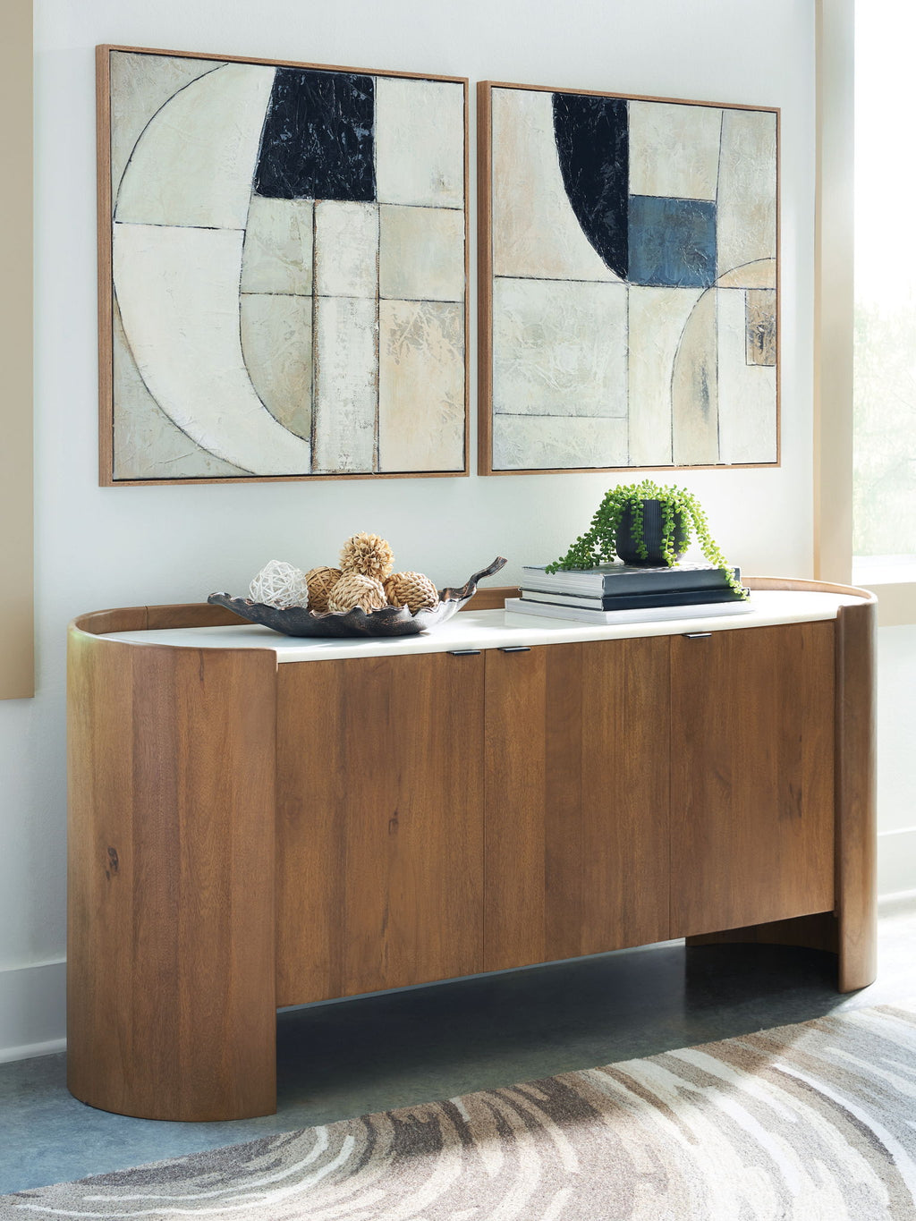 Brown wood accent cabinet with white tabletop and curved panel doors