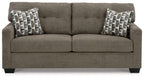 Dark gray sofa with two seat cushions and two patterned throw pillows