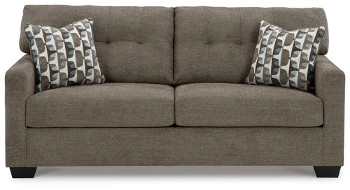 Dark gray sofa with two seat cushions and two patterned throw pillows