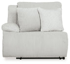 Wall power recliner with light gray ribbed upholstery and plush back cushions
