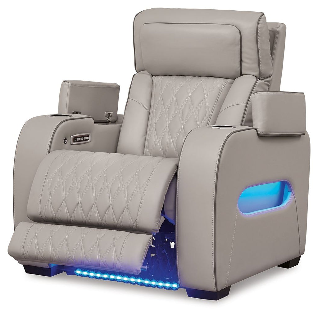 Gray power recliner with side control panel and built-in footrest, showing blue glow light