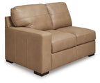 Toffee loveseat with tufted seat cushions, square arms, and short dark legs