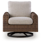Woven swivel lounge chair with gray cushion and dark brown arms, round black base