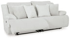 Light gray reclining sectional sofa with striped cushions and multiple throw pillows