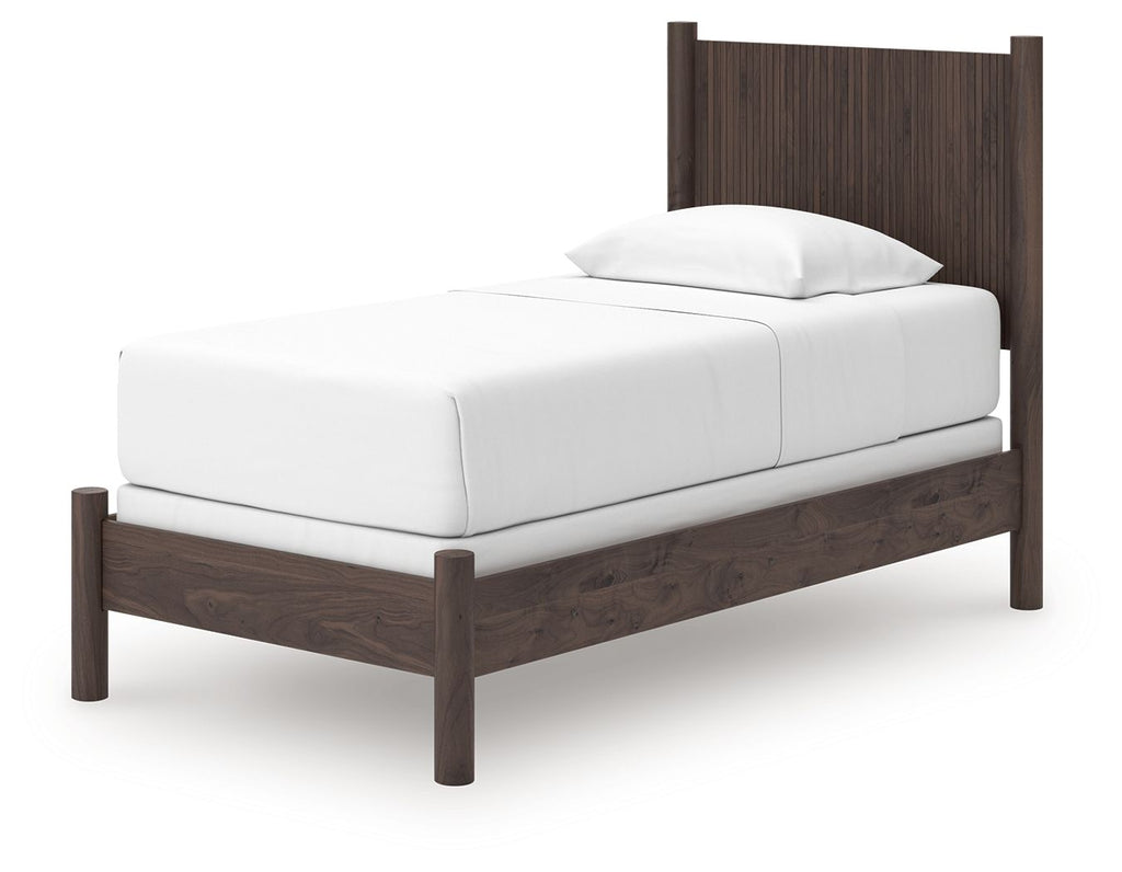 Dark brown panel bed frame with white upholstered mattress and pillow
