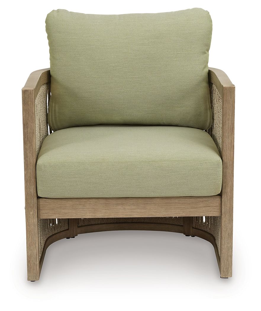 Outdoor lounge chair with green upholstered cushions and light beige wood frame