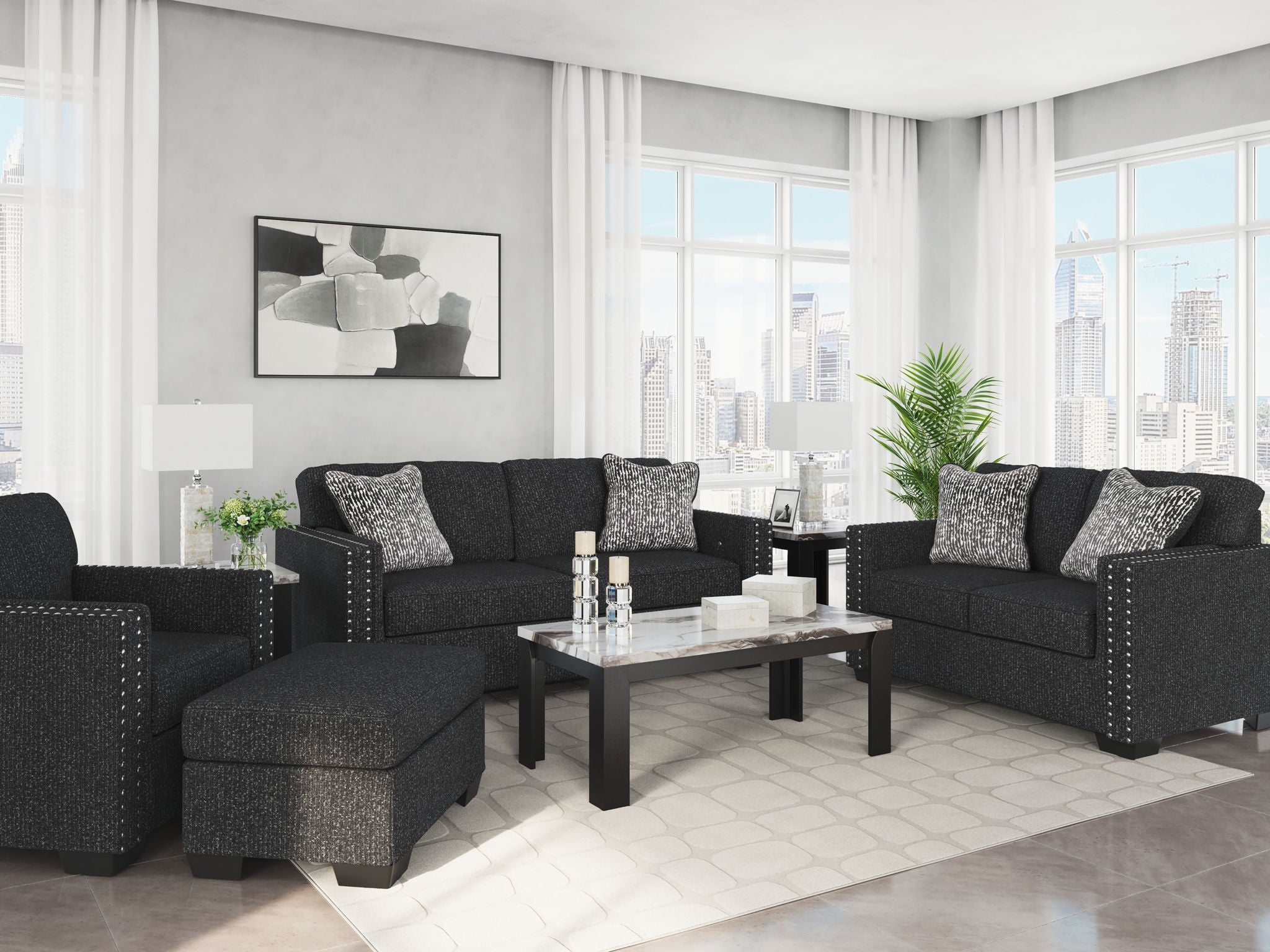Black textured living room set with loveseat, accent chair, and ottoman pieces