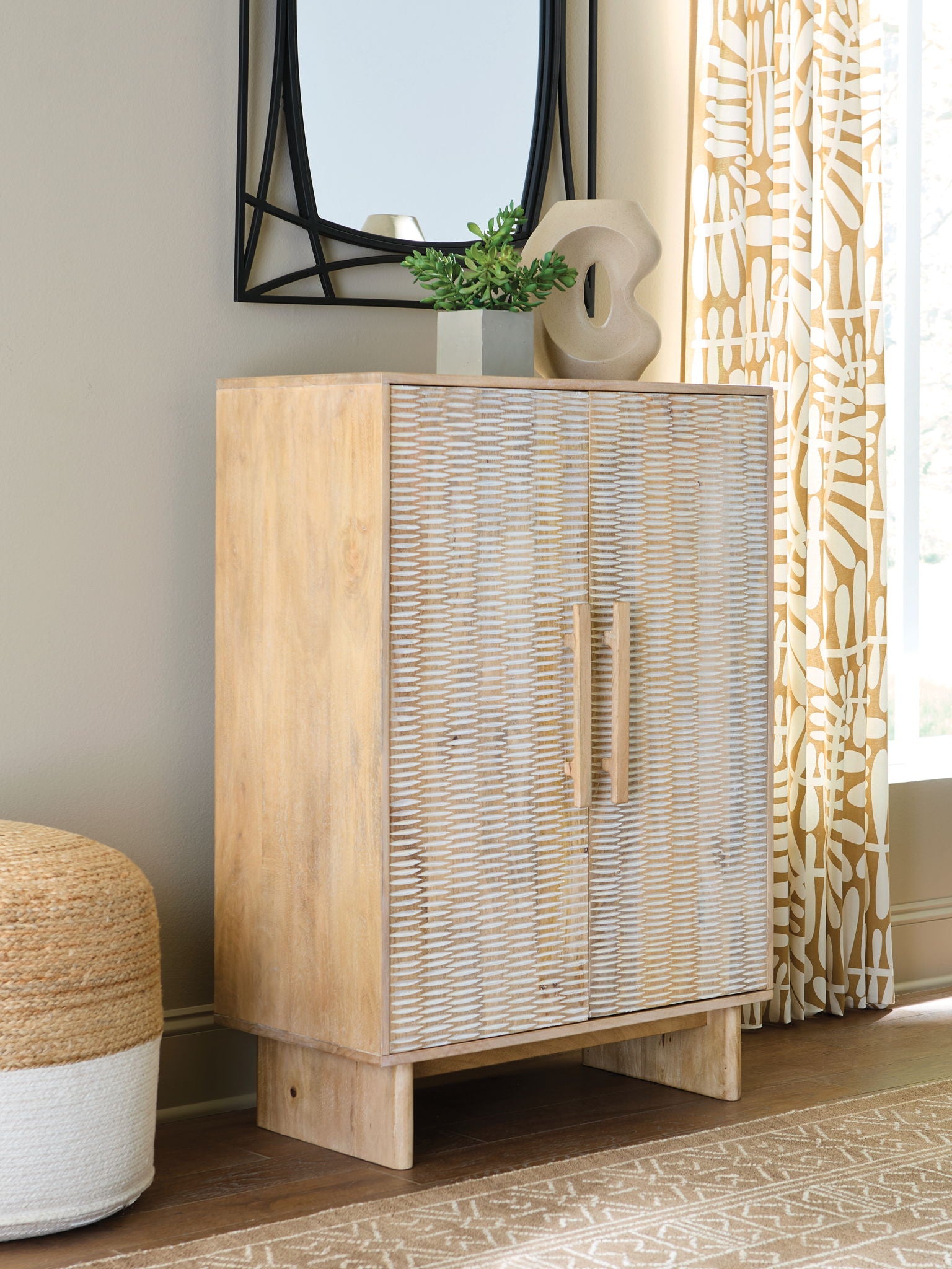 Natural wood accent cabinet with woven rattan cabinet doors and short tapered legs