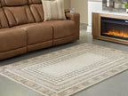 Beige geometric rug with wide border stripe and symmetrical center panel