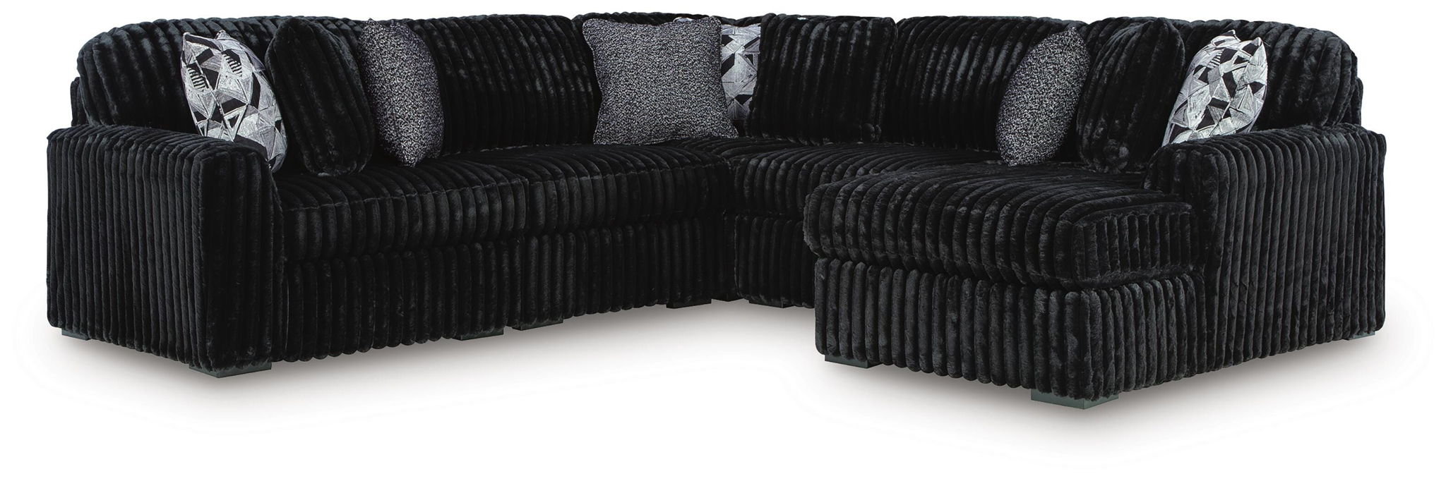 Black corduroy sectional sofa with corner chaise and patterned throw pillows