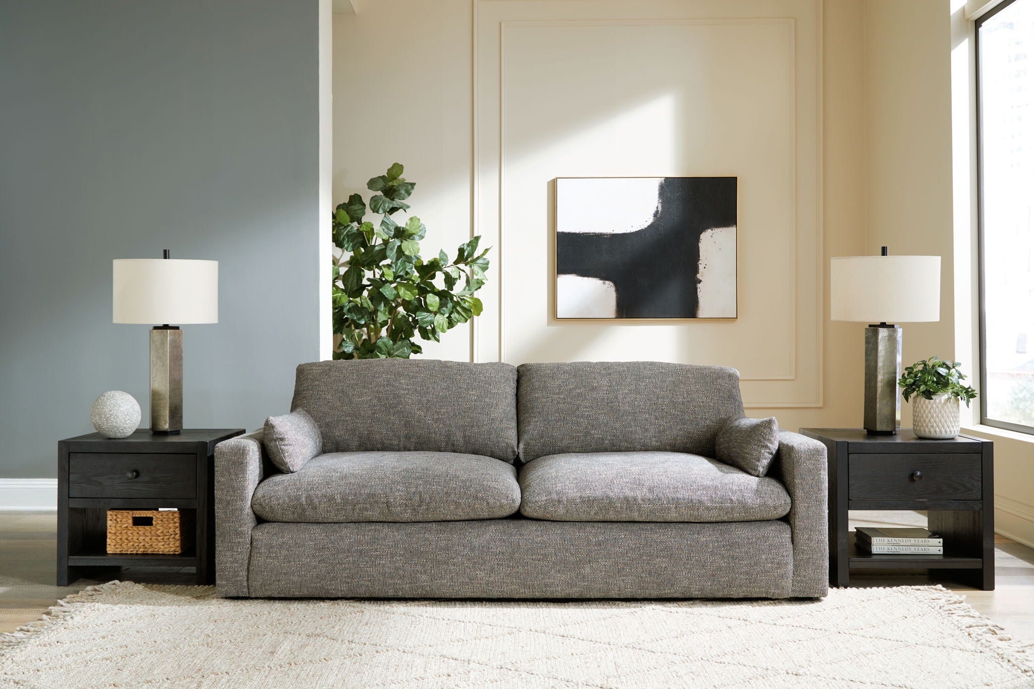 Gray fabric sofa with tufted seat cushions and matching loveseat cushions set