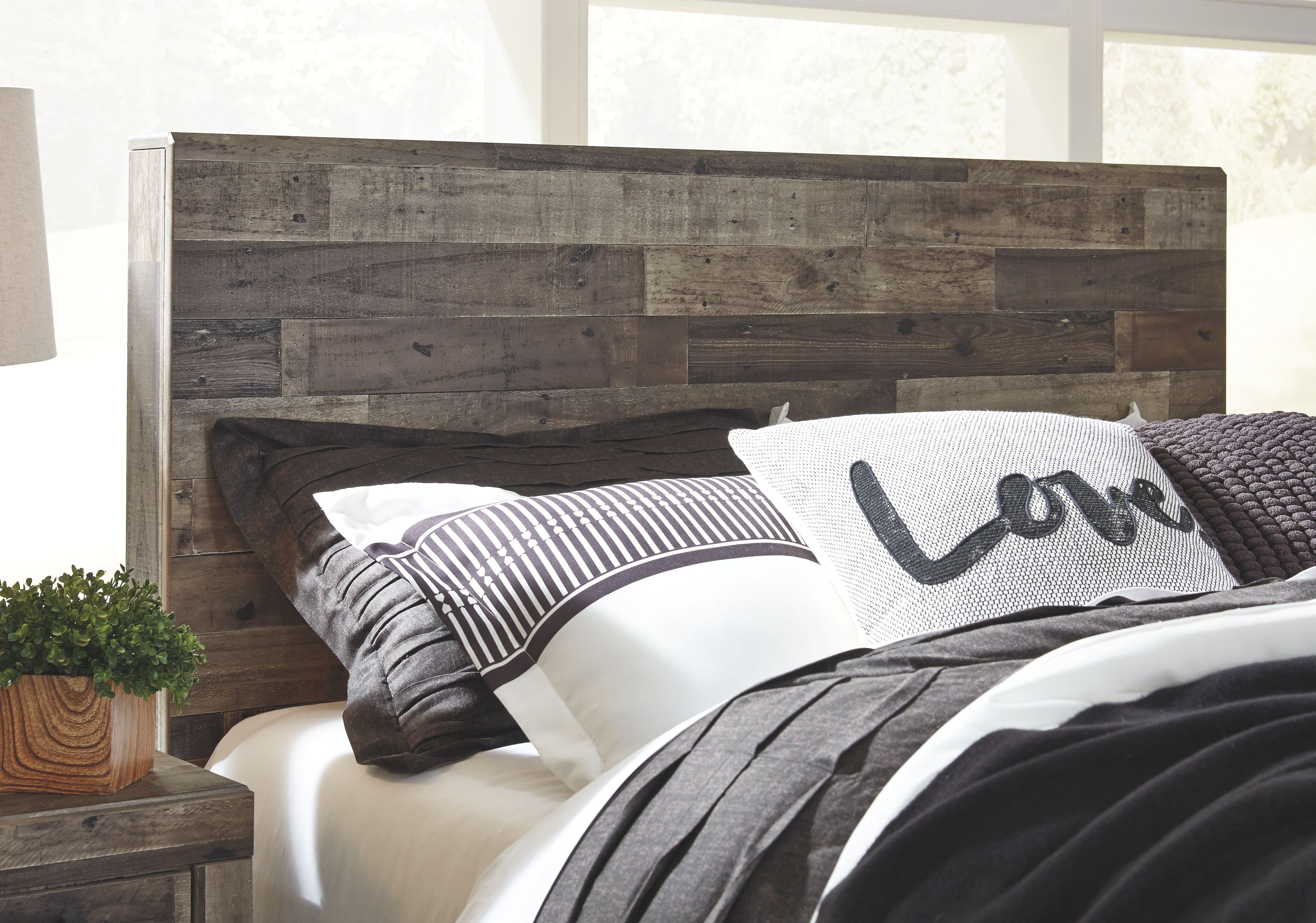 Youth panel bedroom set panel bed headboard with dark wood frame and pillows