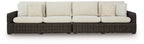 Dark brown wicker loveseat with beige seat, back, and patterned accent cushions