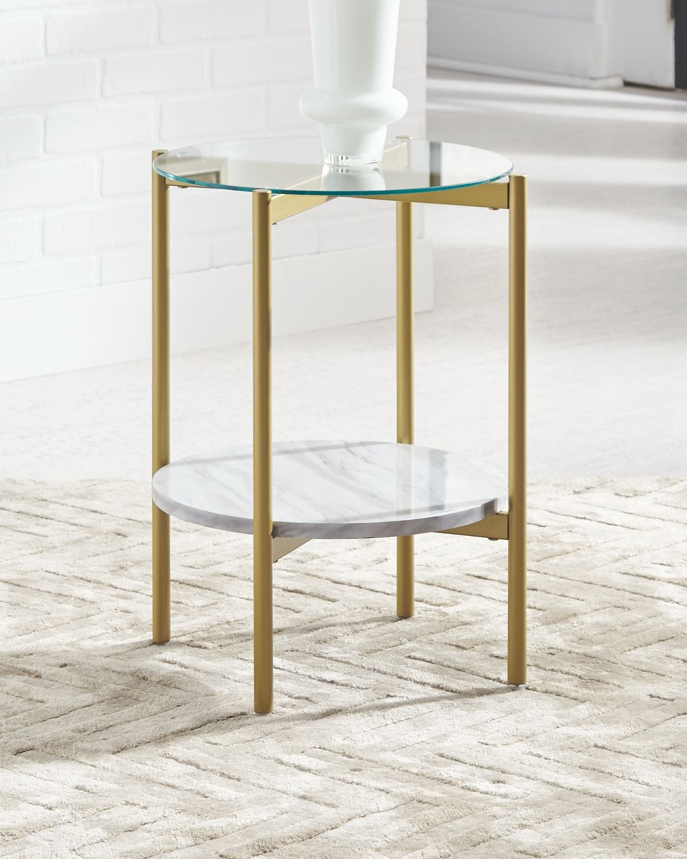 Round end table with clear glass top and white marble-look shelf, gold frame