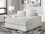 Oversized chaise lounge with ribbed upholstery and two back cushions, light gray