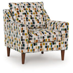 Multicolor patterned accent chair with square fabric, padded arms, dark wood legs.