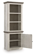 Distressed pier cabinet with open side door revealing shelving compartments