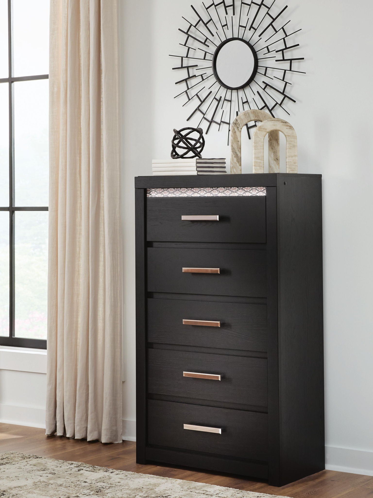 Black five-drawer chest with silver bar handles